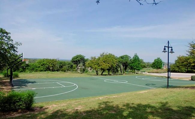 View of sport court featuring community basketball court and a lawn | Image 33