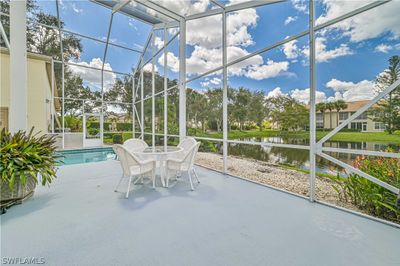 Unfurnished sunroom featuring a water view | Image 2