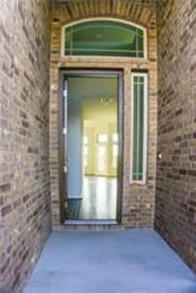 Property entrance with brick siding | Image 4
