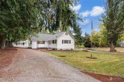 This charming, 3-bed, 2 bath farmhouse on 3+ acres has over $100, 000 in upgrades, ensuring most of the hard work is done. | Image 1