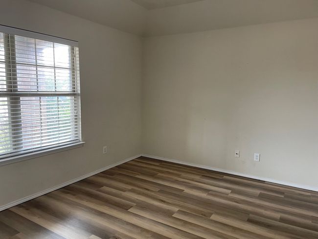 Spare room with plenty of natural light and wood finished floors | Image 8