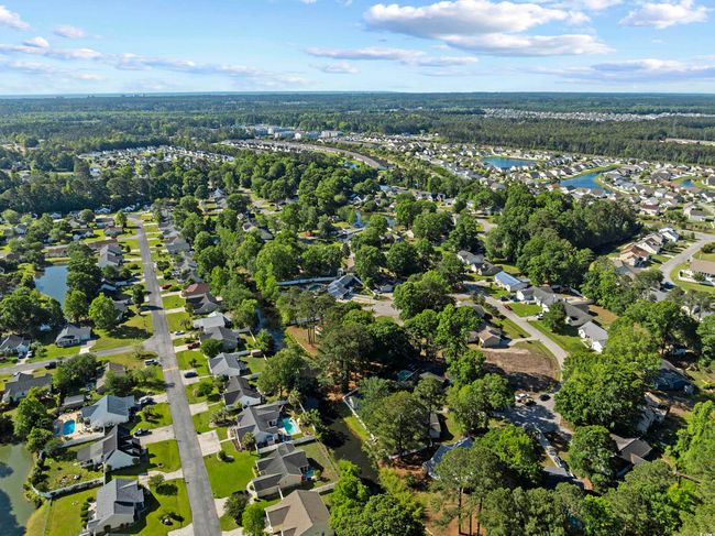 Drone / aerial view featuring a water view, a view of trees, and a residential view | Image 29