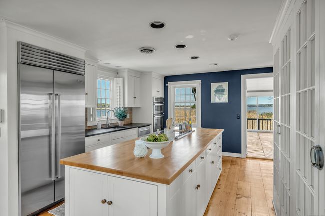 The Well-Appointed Kitchen Features Custom Cabinets, Wood Countertops And A Spacious Pantry | Image 8
