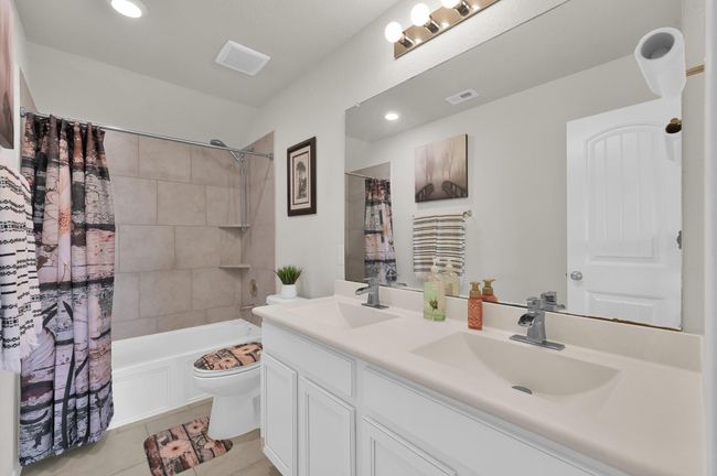The upstairs full bathroom features dual sinks, perfect for busy mornings. | Image 25