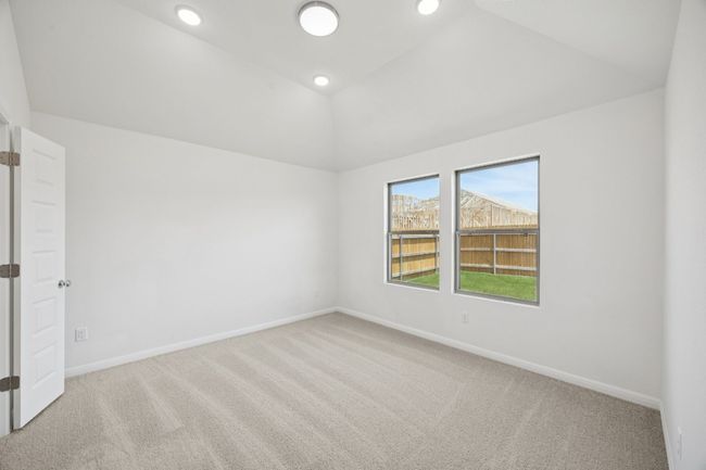 Carpeted empty room with vaulted ceiling and recessed lighting | Image 19