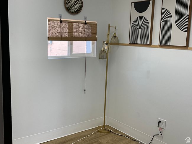 Empty room featuring baseboards and wood finished floors | Image 21