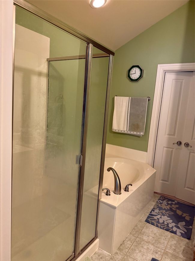 Full bath with lofted ceiling, a bath, and a shower stall | Image 30