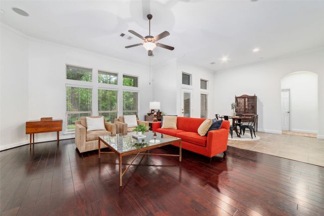 The large, open living room is the perfect place to entertain. | Image 12