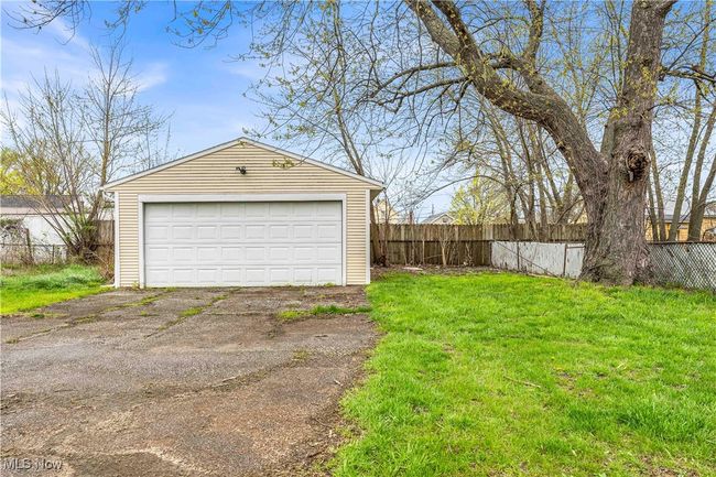Detached garage featuring fence | Image 22