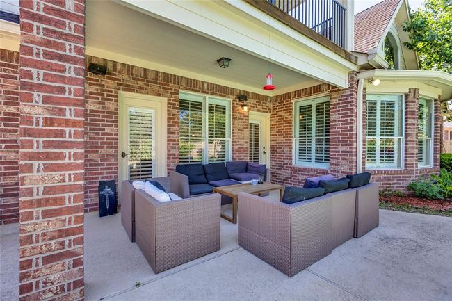 Great outdoor living with covered patio to enjoy the large mature back yard | Image 34