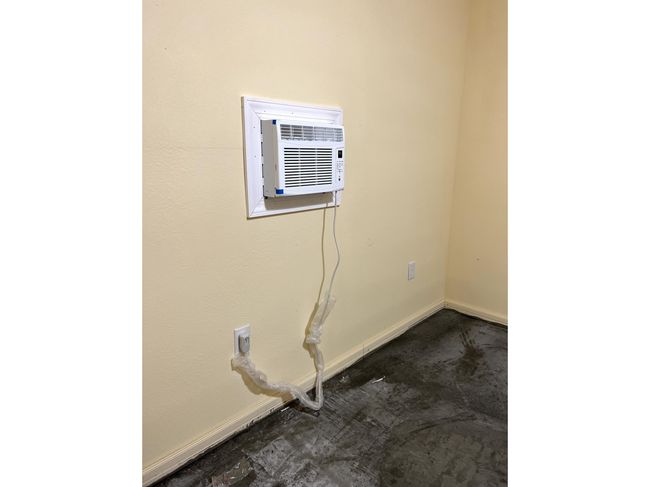 Washroom featuring a wall mounted air conditioner | Image 14