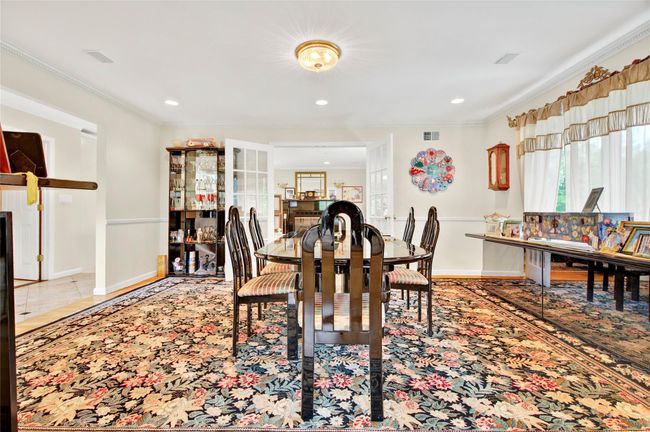 Dining room with ornamental molding, baseboards, and recessed lighting | Image 9