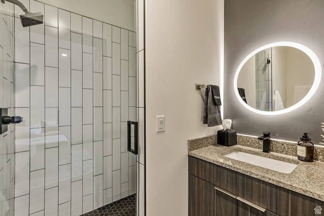 Bathroom with a stall shower and vanity | Image 47
