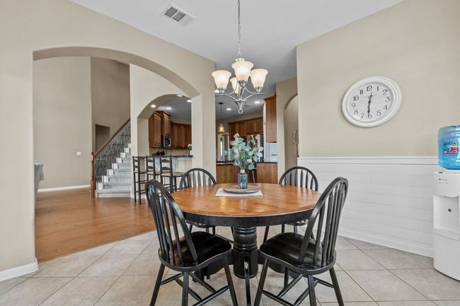 Surrounded by natural light and scenic views, this inviting breakfast nook is the perfect place to begin your day in style. | Image 9