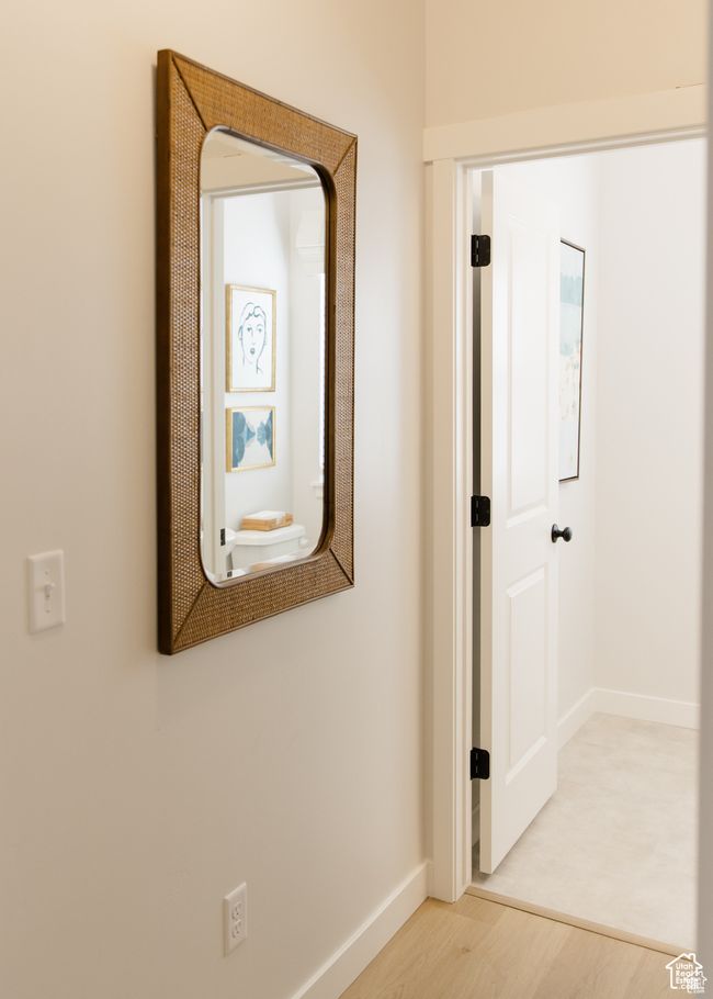 Corridor with wood finished floors and baseboards | Image 7