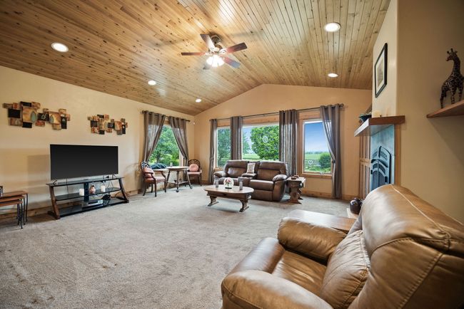 Spacious great room with high wood ceilings and beautiful views. | Image 9