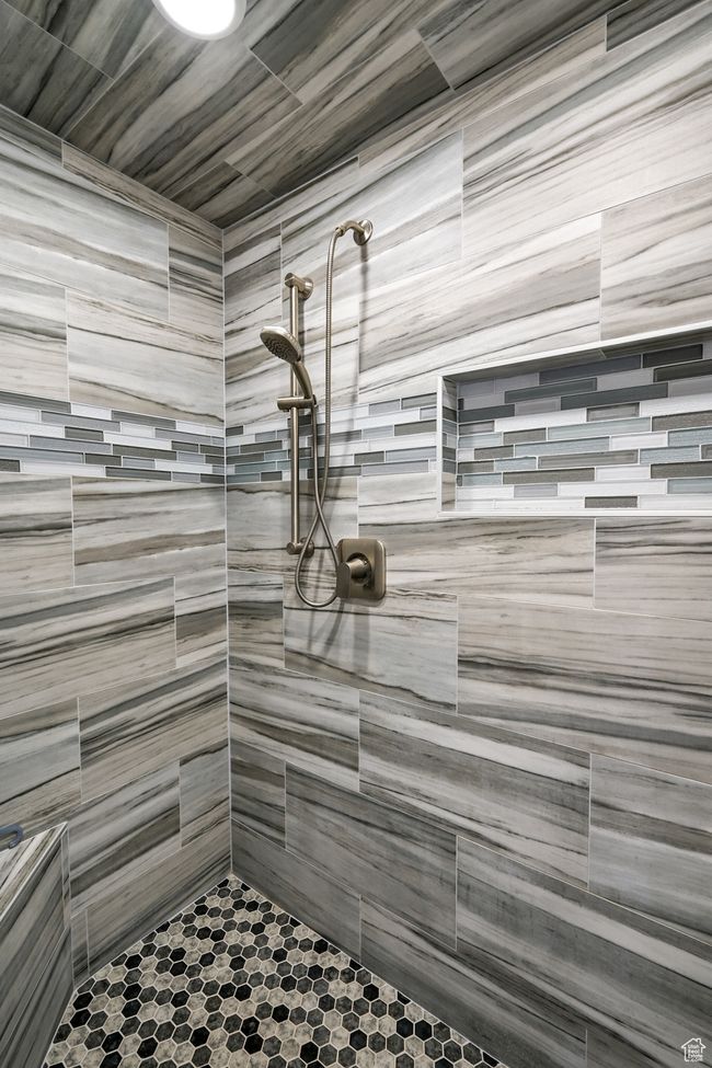Bathroom featuring tiled shower | Image 47