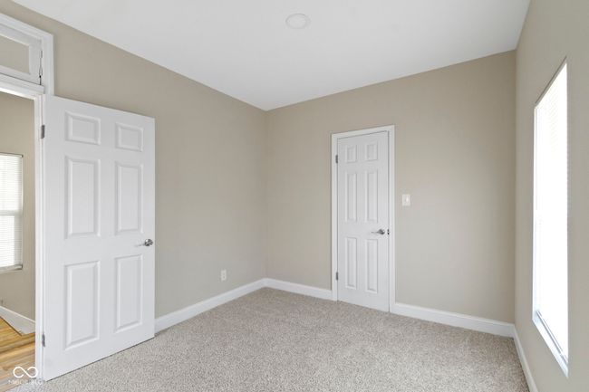 spare room featuring baseboards and light carpet | Image 26