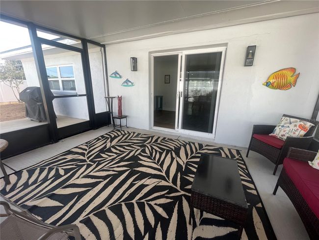 Bonus room leads to screened back patio | Image 8