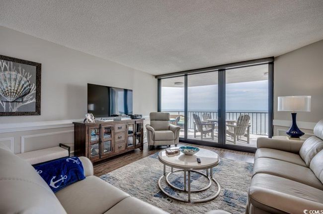 Living room featuring hardwood / wood-style flooring and a textured ceiling | Image 6