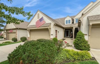 View of front facade featuring a garage | Image 1