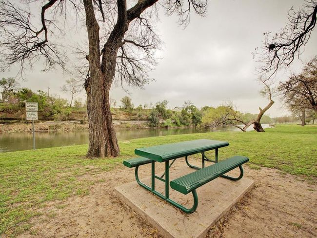 Surrounding community with a water view and a lawn | Image 27