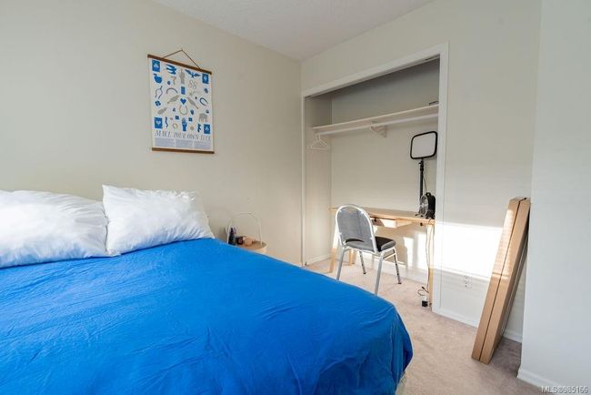 Carpeted bedroom with a closet | Image 12