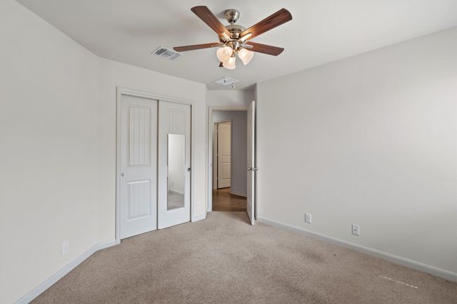 Bedroom 2 -- closet and ceiling fan | Image 18