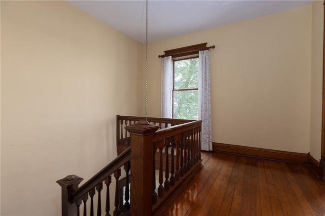 Bedroom with hardwood / wood-style flooring | Image 28