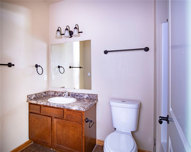 Bathroom featuring vanity and toilet | Image 14
