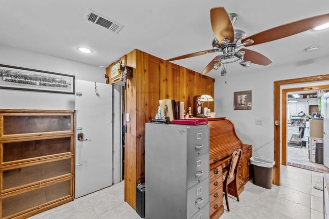 Office space with ceiling fan, visible vents, recessed lighting, and light tile patterned floors | Image 33
