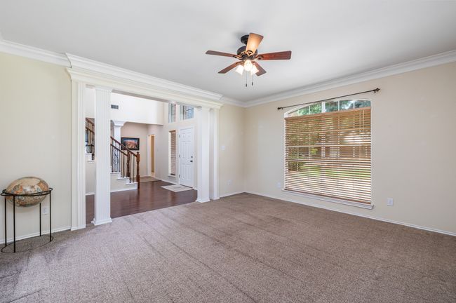 The formal dining room is situated in a way that makes it perfect for a large table or a home office. | Image 7