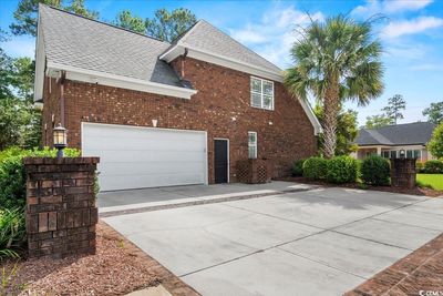 View of side of property with a garage | Image 2