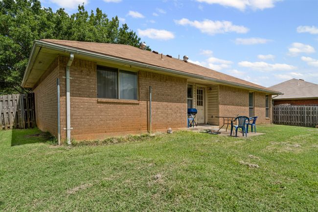 Back of property with brick siding and a patio area | Image 22