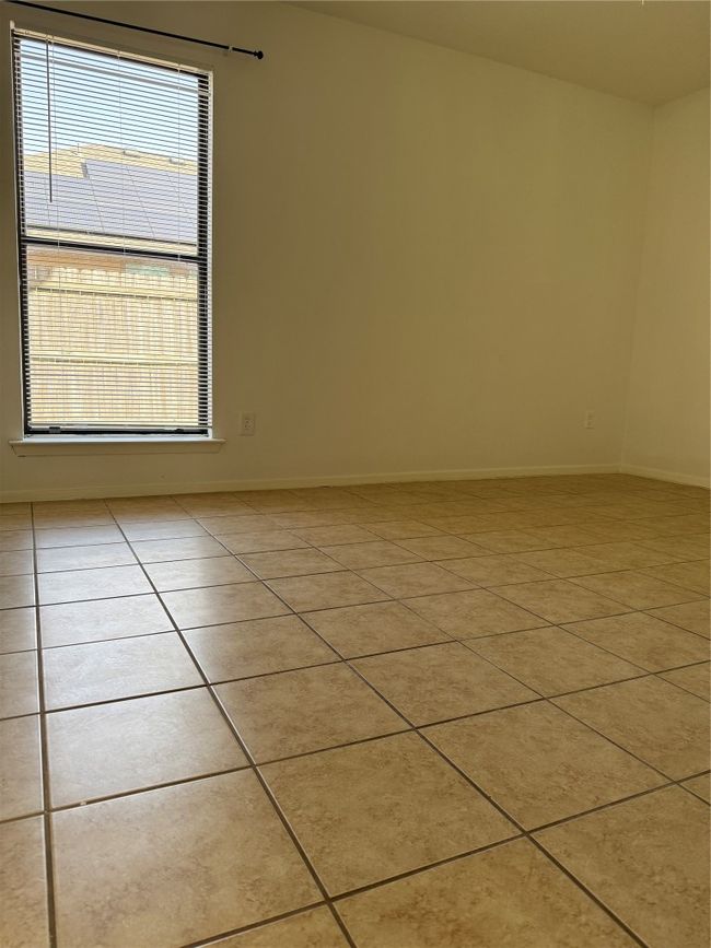 Spare room with baseboards and tile patterned flooring | Image 10