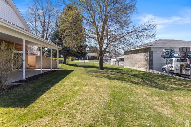 View of yard featuring a patio and fence | Image 42