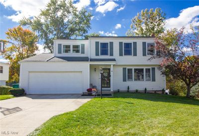 View of front of house featuring a front yard and a garage | Image 1