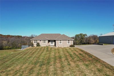 Ranch-style house featuring a front yard | Image 1