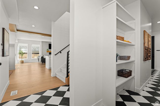 Hallway with recessed lighting, stairs, light floors, and built in features | Image 25