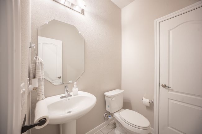 Bathroom with sink and toilet | Image 15