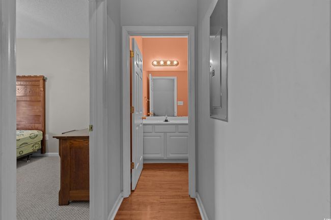 Hall with a sink, light wood finished floors, and baseboards | Image 5