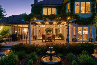 Deck, pergola and extensive landscape lighting with ivy-covered deck trellis | Image 2