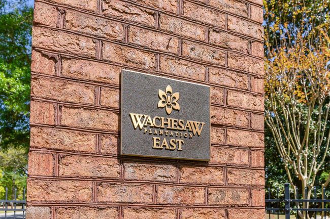 View of front facade featuring a front yard, brick siding, and a patio area | Image 35