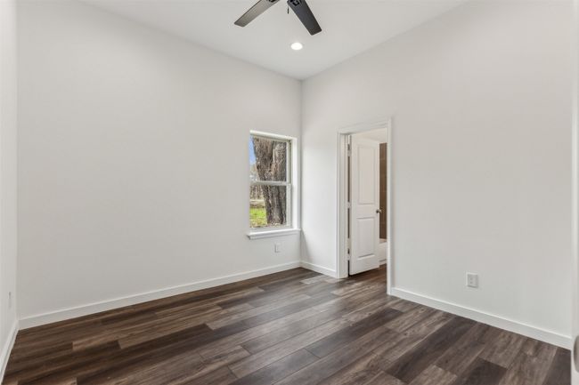 Unfurnished room with dark wood-style flooring, ceiling fan, and recessed lighting | Image 24