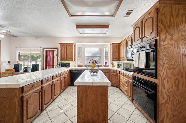 Another view of the kitchen looking towards the sink. Your resident cook will love cooking in this kitchen with so much space and counterspace. | Image 27