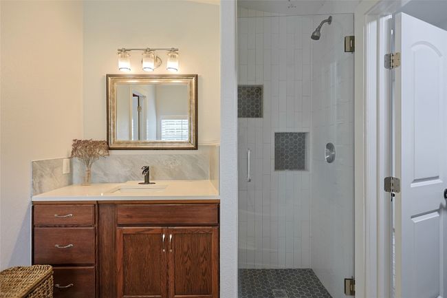 Full bathroom with vanity and a stall shower | Image 16