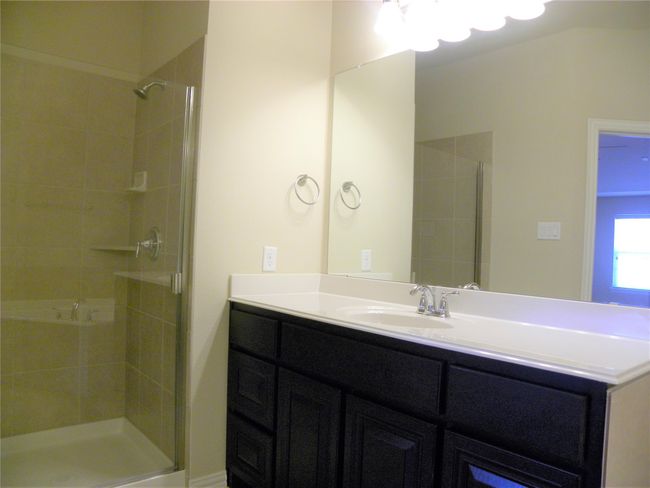 Full bathroom with a shower stall and vanity | Image 27