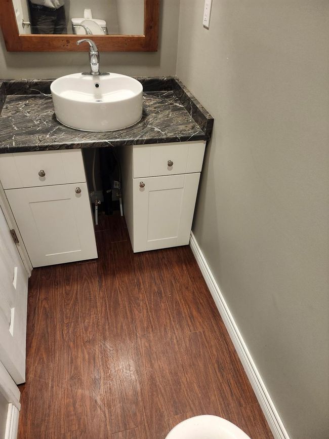 Bathroom featuring wood finished floors and vanity | Image 6
