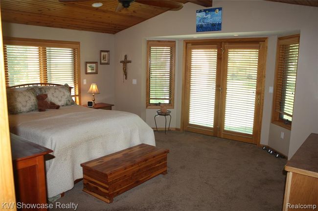 Beautiful master suite with french doors to the patio, 2 walk in closets, and an ensuite bathroom. | Image 24