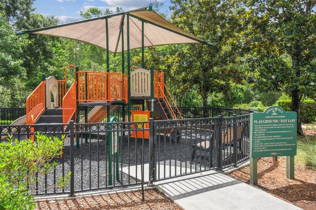 Spring Isle offers resort-style amenities with low HOA fees of only $243/month, which cover the roof, exterior paint, and lawn maintenance—making this a true low-maintenance home. Community amenities include a sparkling pool, playground, dog park, and a fully equipped fitness center. | Image 32